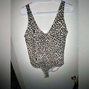 Excellent used condition, cheetah bodysuit.